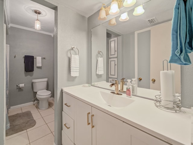 bathroom with crown molding, toilet, vanity, and tile patterned flooring