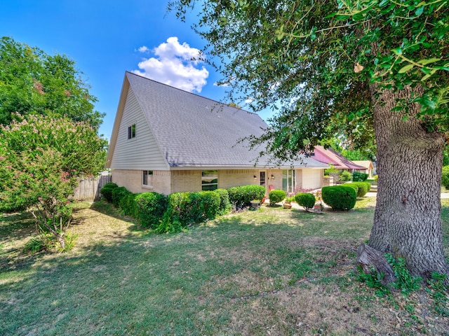 view of home's exterior featuring a lawn