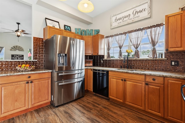 kitchen featuring dark hardwood / wood-style floors, black dishwasher, stainless steel refrigerator with ice dispenser, backsplash, and sink