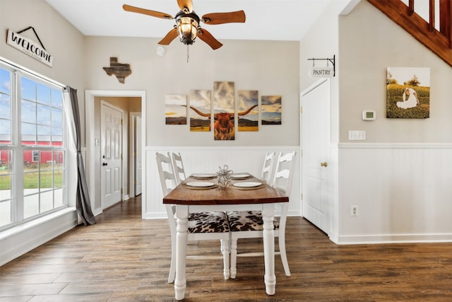 dining area featuring ceiling fan and dark hardwood / wood-style flooring