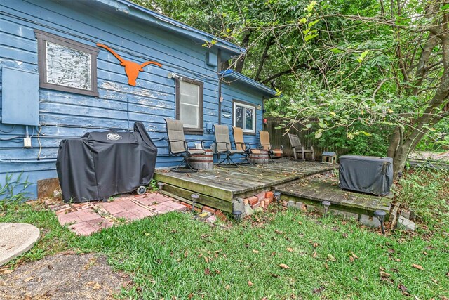 exterior space featuring grilling area and a yard