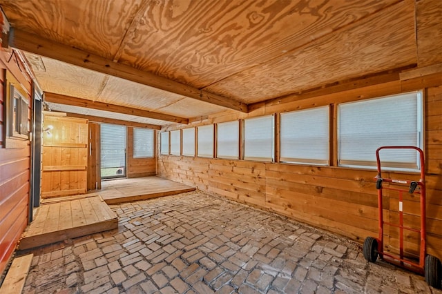 unfurnished sunroom featuring wood ceiling