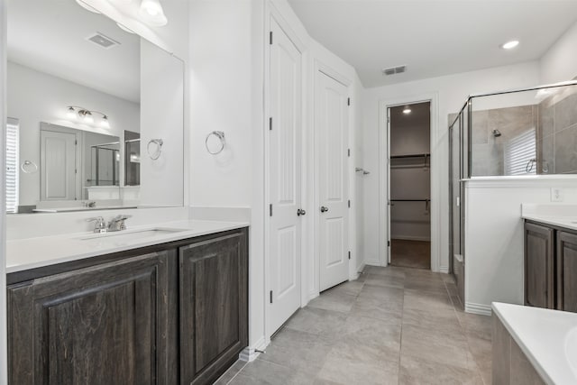 bathroom featuring tile patterned floors, independent shower and bath, and vanity