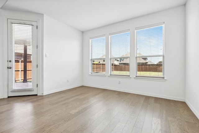 spare room featuring light hardwood / wood-style flooring