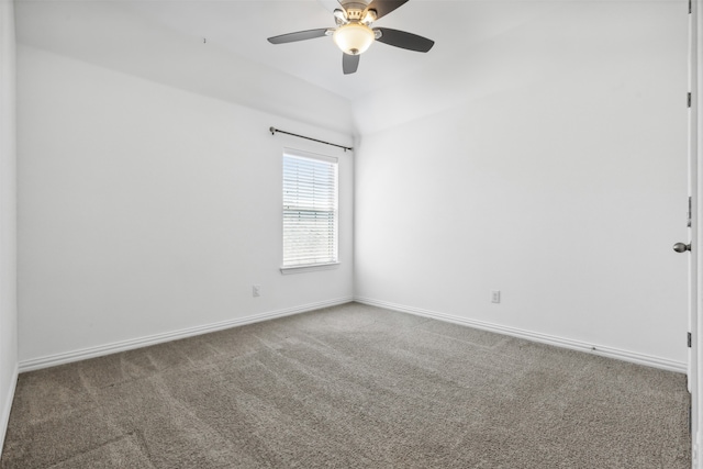 unfurnished room featuring ceiling fan and carpet