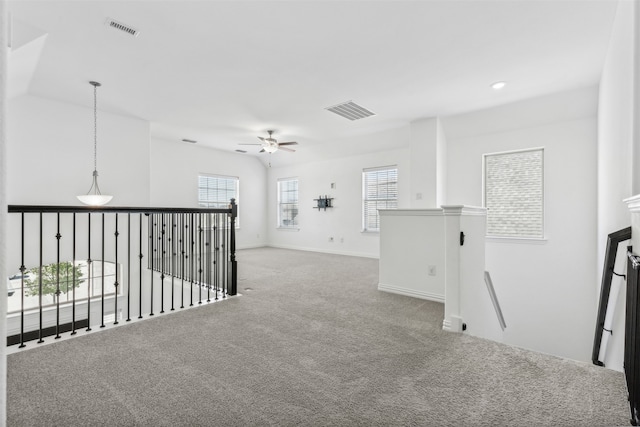 interior space with ceiling fan