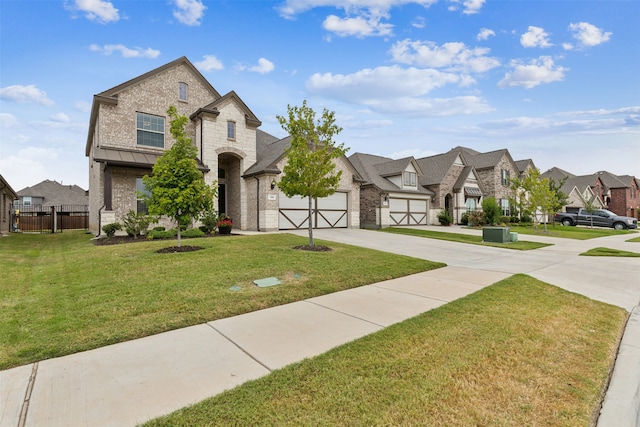 french country inspired facade with a garage and a front yard