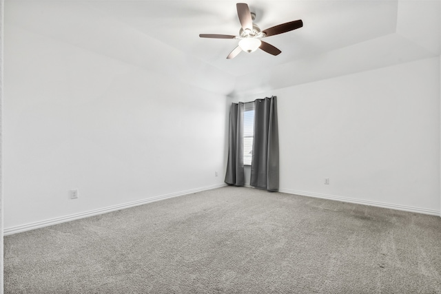 unfurnished room featuring carpet, lofted ceiling, and ceiling fan