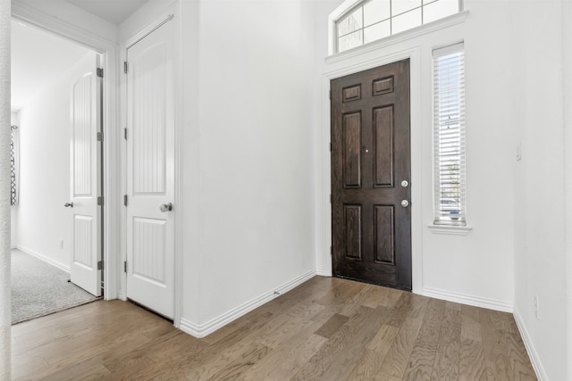 entryway with light wood-type flooring and a healthy amount of sunlight