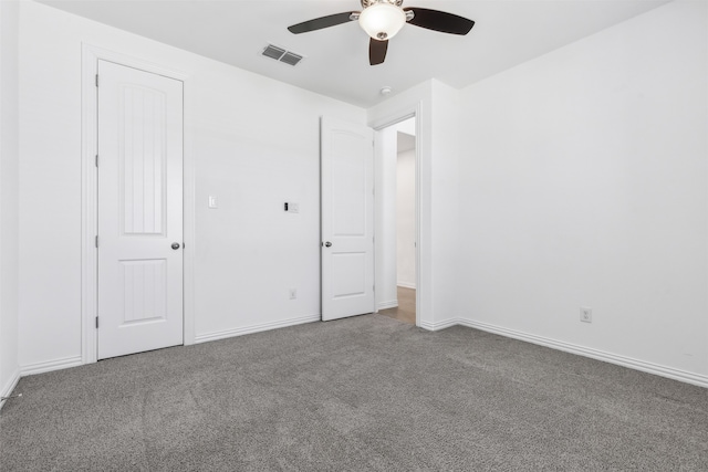 unfurnished bedroom featuring ceiling fan and carpet flooring