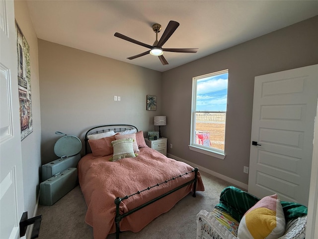 bedroom featuring light carpet and ceiling fan