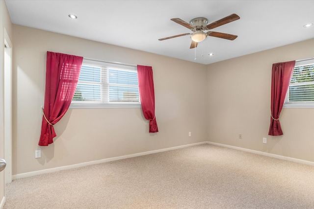 empty room featuring carpet floors and ceiling fan