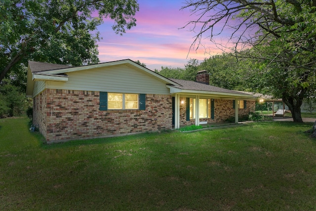 view of front of house with a lawn