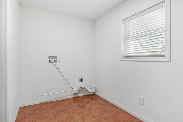 washroom with tile patterned floors, hookup for an electric dryer, and washer hookup