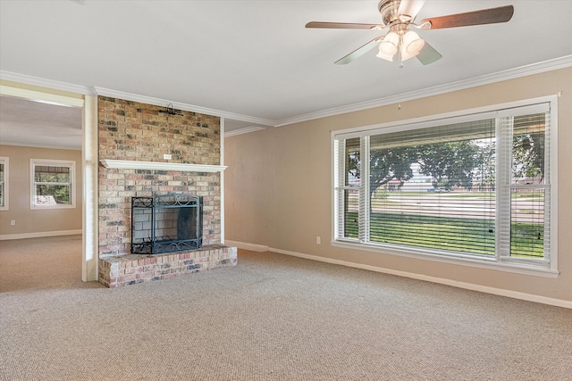 unfurnished living room with carpet floors, a fireplace, brick wall, ceiling fan, and ornamental molding