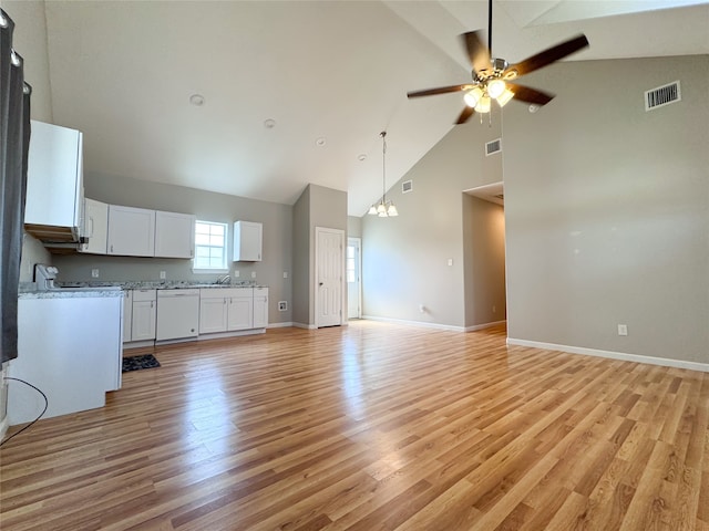 unfurnished living room with ceiling fan, high vaulted ceiling, and light wood-type flooring