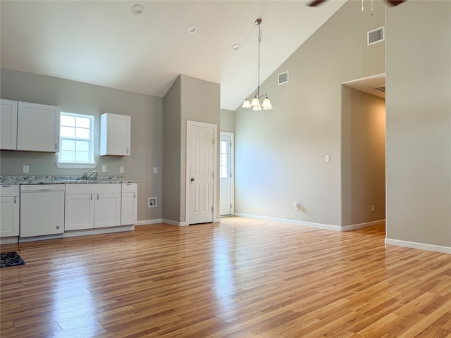 kitchen with white cabinetry, sink, light wood-type flooring, high vaulted ceiling, and white dishwasher