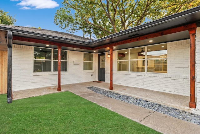 entrance to property with a yard