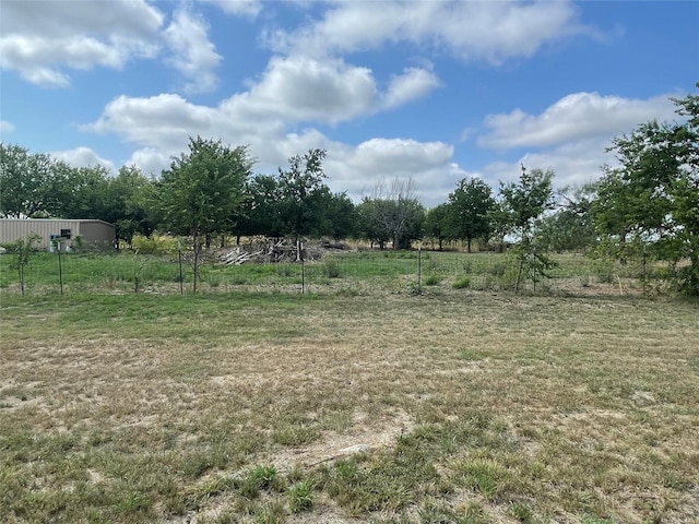 view of yard with a rural view