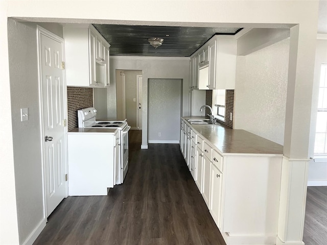 kitchen featuring sink, white cabinetry, dark hardwood / wood-style floors, white range with electric stovetop, and a wealth of natural light