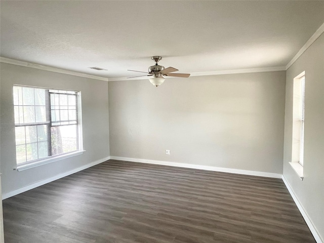 unfurnished room with crown molding, dark wood-type flooring, and ceiling fan