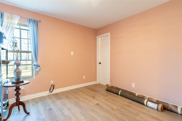 unfurnished room featuring hardwood / wood-style flooring