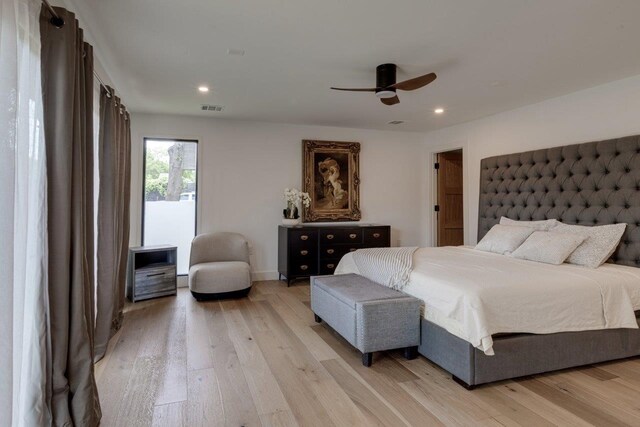 bedroom featuring ceiling fan and light hardwood / wood-style flooring