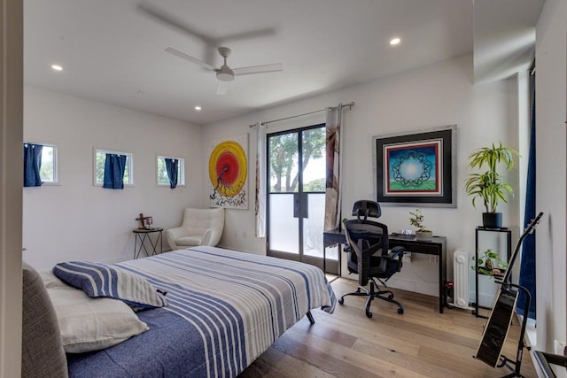 bedroom featuring ceiling fan, access to outside, and light wood-type flooring