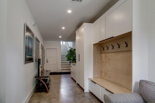 mudroom featuring concrete flooring