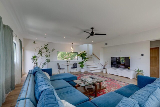 living room with plenty of natural light and light hardwood / wood-style floors