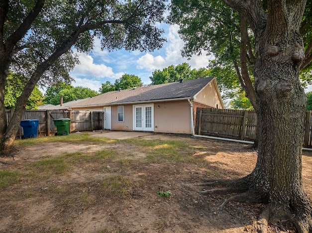 back of property featuring french doors