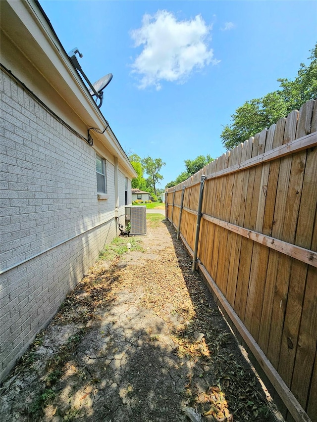 view of yard featuring central AC unit