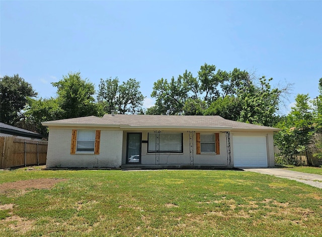 ranch-style house featuring a garage, covered porch, and a front lawn