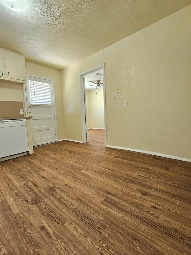 spare room with light hardwood / wood-style floors and a textured ceiling