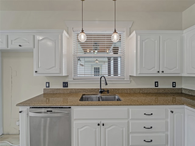 kitchen with sink, stainless steel dishwasher, white cabinets, and dark stone counters