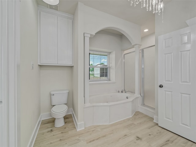 bathroom with toilet, hardwood / wood-style floors, and independent shower and bath