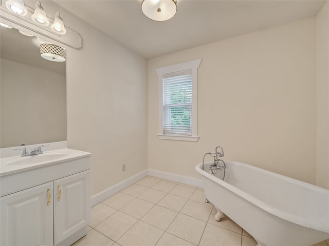 bathroom with vanity, tile patterned flooring, and a washtub