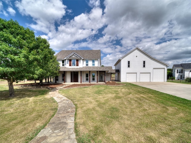 view of front of home featuring a garage and a front lawn