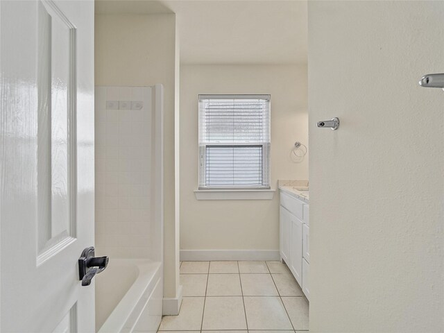 bathroom featuring vanity, tub / shower combination, and tile patterned flooring