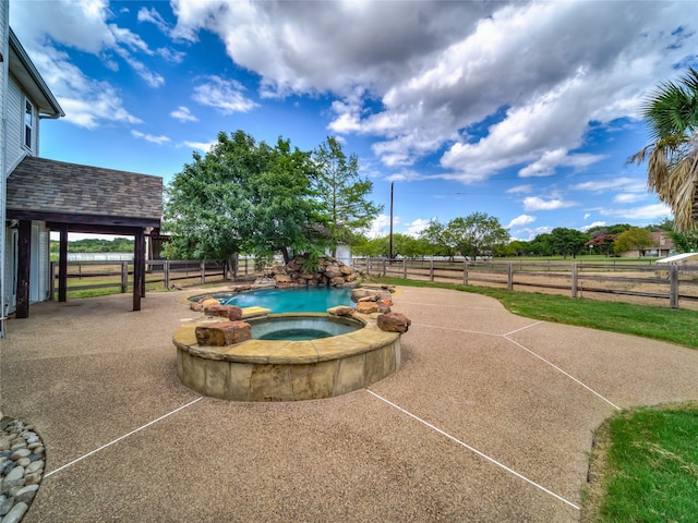 view of pool featuring an in ground hot tub and a patio