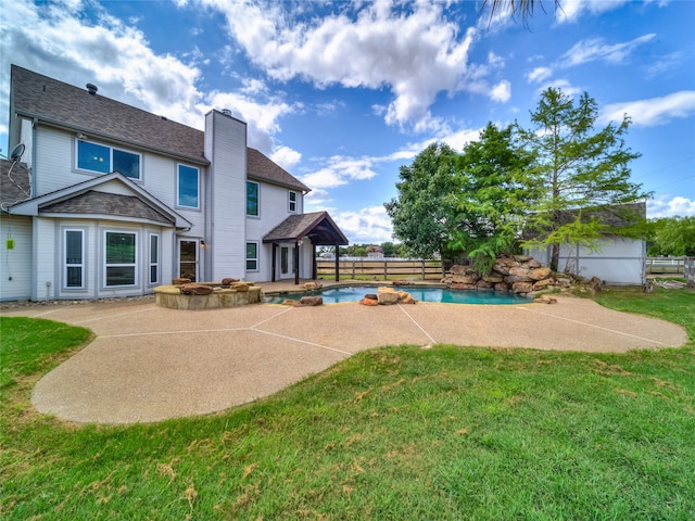 exterior space with a patio area and a lawn