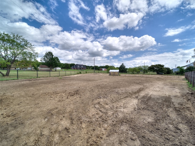 view of yard with a rural view