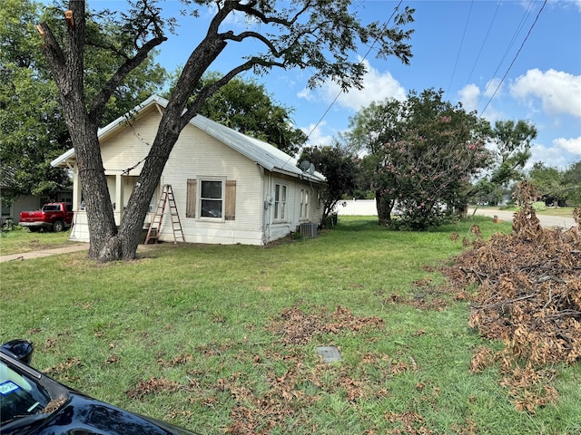 view of home's exterior with a lawn