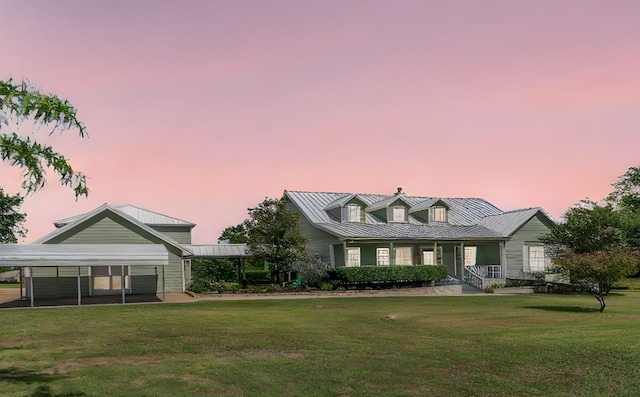 view of front of house featuring a yard and a carport