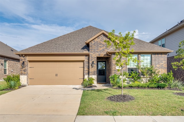 view of front facade with a garage and a front yard