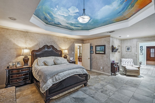 bedroom with ornamental molding and a raised ceiling