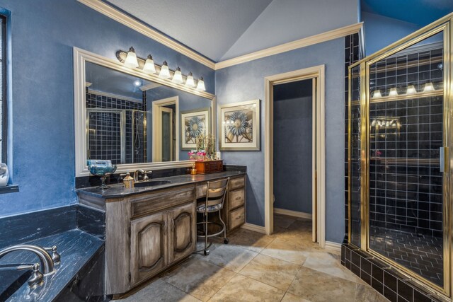 bathroom featuring tile patterned floors, vanity, separate shower and tub, and vaulted ceiling