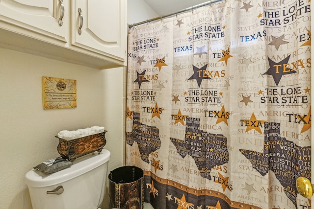 bathroom with walk in shower and toilet