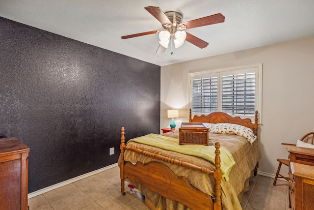 tiled bedroom with ceiling fan