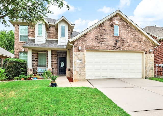 view of front of home featuring a garage and a front lawn